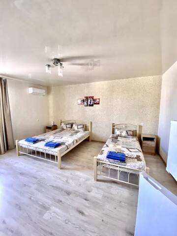 Фото номера Трехместный номер Отель Holiday г. Бердянск 5